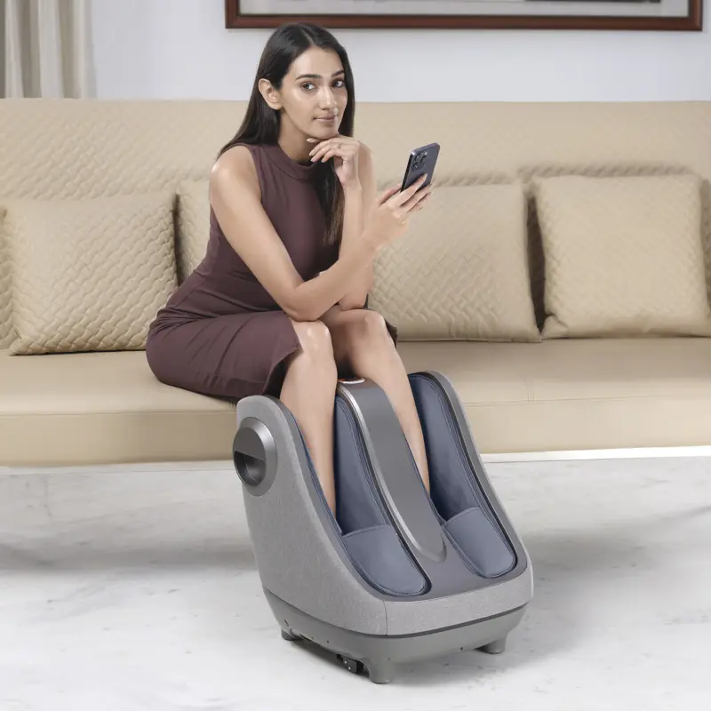 Women working while enjoying a massage in foot massager