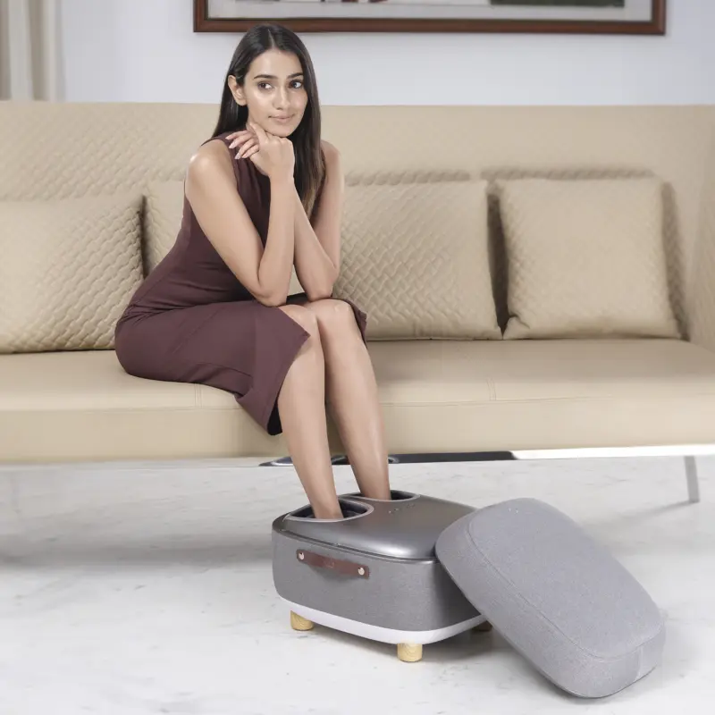 Woman Sitting on Sofa and taking massage on LI650 Foot Massager
