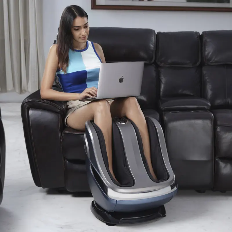 Women Working While Enjoying a Massage in Foot Massager